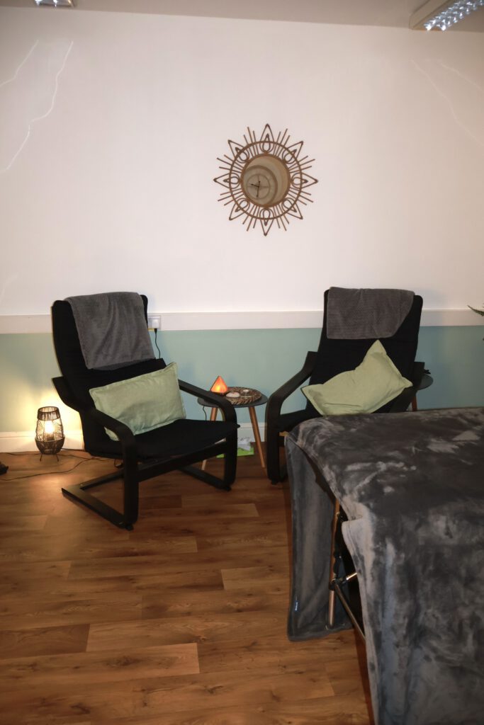 Two comfortable chairs side by side in therapy room