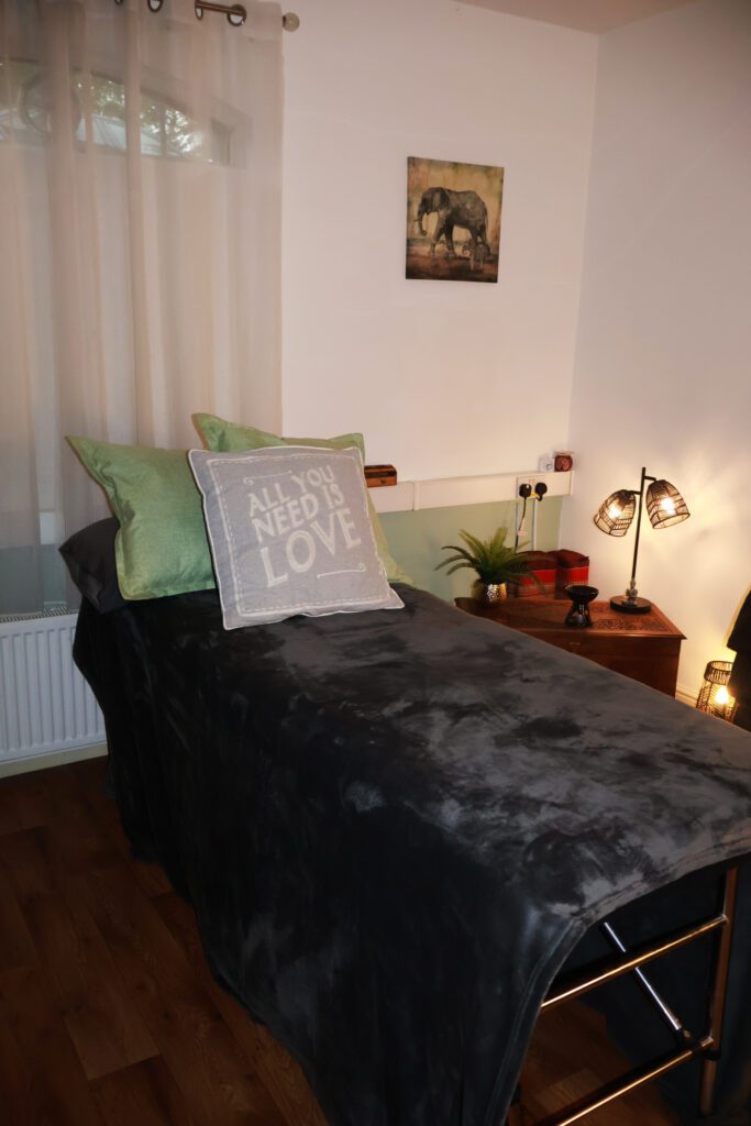 Therapy bed with soft blankets and cushions